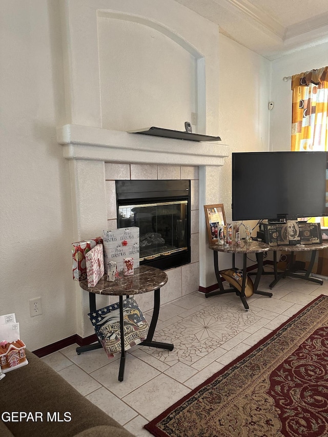 14045 Lago Seco Dr, Horizon City, TX 79928 - tiled living area featuring a tiled fireplace, baseboards, and crown molding