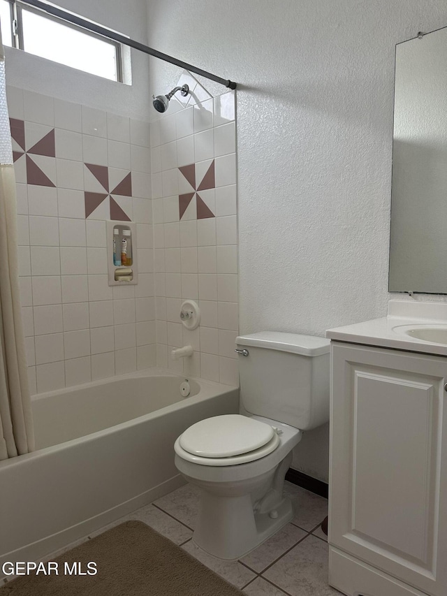 14045 Lago Seco Dr, Horizon City, TX 79928 - full bath featuring a textured wall, tile patterned floors, toilet, shower / bath combination with curtain, and vanity