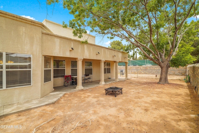 view of patio / terrace with a fenced backyard and a fire pit