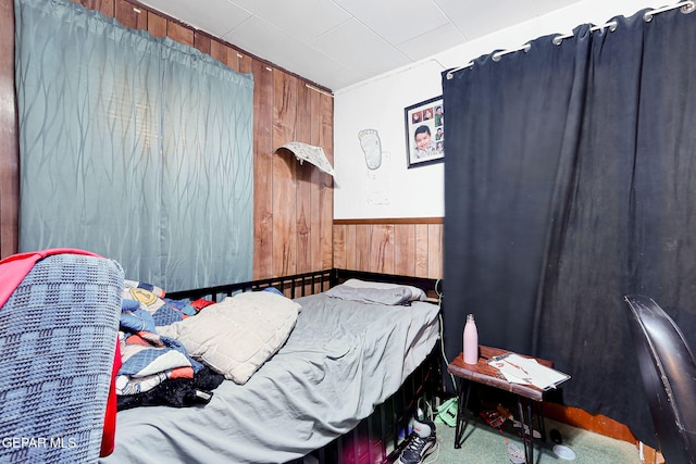 564 Chula Vista St, El Paso, TX 79915 - carpeted bedroom with wooden walls