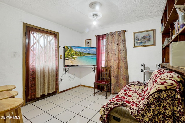 564 Chula Vista St, El Paso, TX 79915 - living area with a textured ceiling and light tile patterned flooring