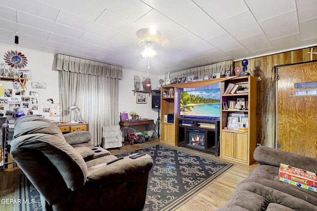 564 Chula Vista St, El Paso, TX 79915 - living area featuring wood finished floors and wood walls