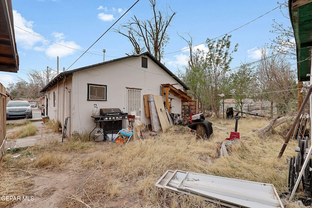 564 Chula Vista St, El Paso, TX 79915 - rear view of property featuring stucco siding