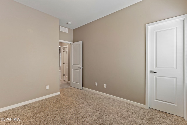 14172 Peyton Edwards Ave, El Paso, TX 79938 - unfurnished bedroom featuring light carpet and baseboards
