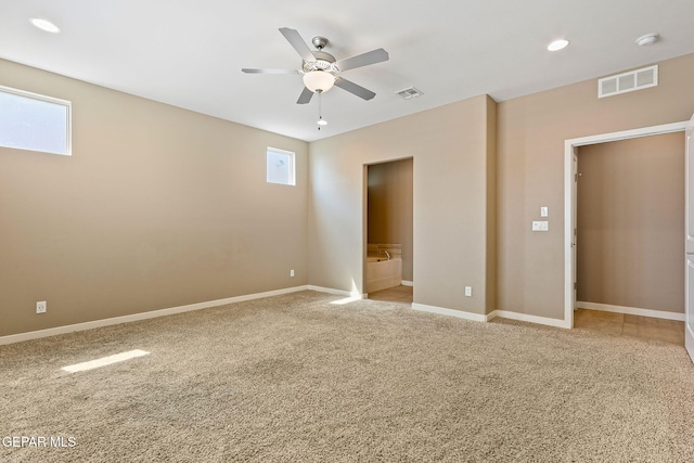 14172 Peyton Edwards Ave, El Paso, TX 79938 - unfurnished bedroom featuring multiple windows, light carpet, baseboards, and recessed lighting