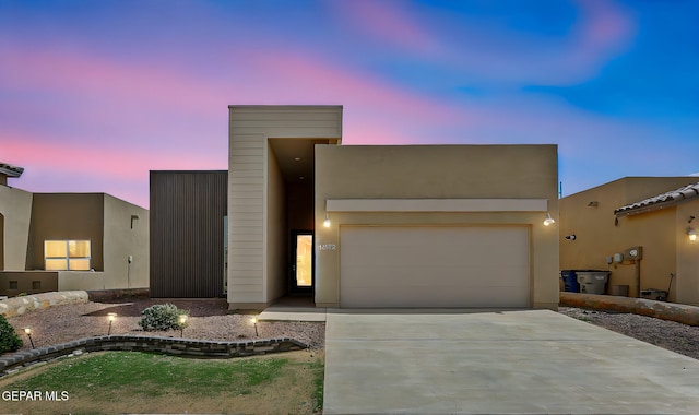 14172 Peyton Edwards Ave, El Paso, TX 79938 - view of front of property with concrete driveway, an attached garage, and stucco siding