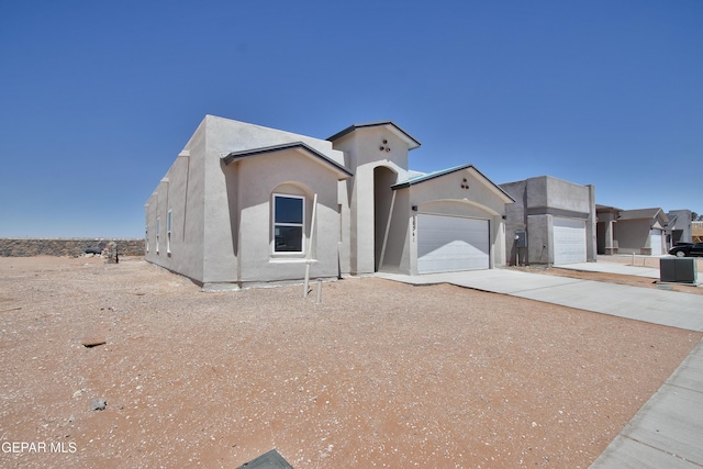 15341 Idea Ln, El Paso, TX 79938 - mediterranean / spanish-style home with concrete driveway, a garage, and stucco siding