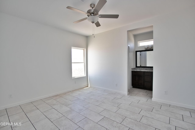 15341 Idea Ln, El Paso, TX 79938 - unfurnished room featuring healthy amount of natural light, ceiling fan, baseboards, and light tile patterned floors