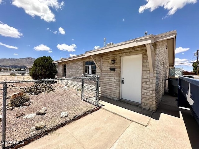 5017 Sierra Madre Dr, El Paso, TX 79904 - view of exterior entry with fence and a mountain view