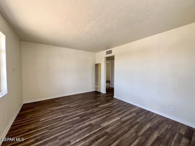 5017 Sierra Madre Dr, El Paso, TX 79904 - empty room featuring dark wood-style floors and baseboards