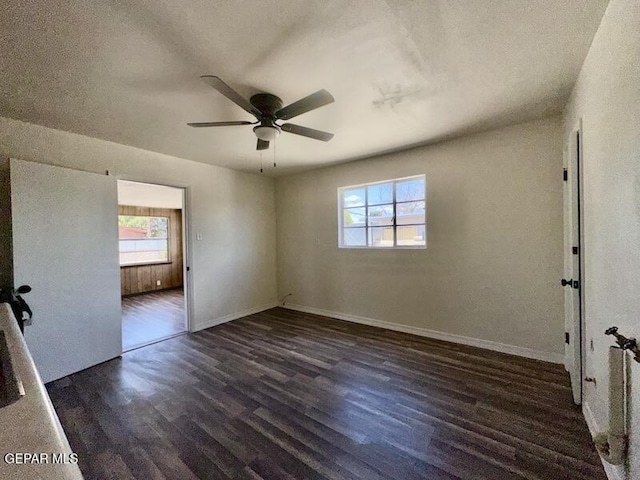5017 Sierra Madre Dr, El Paso, TX 79904 - unfurnished room featuring healthy amount of natural light, wood finished floors, a ceiling fan, baseboards, and a textured ceiling