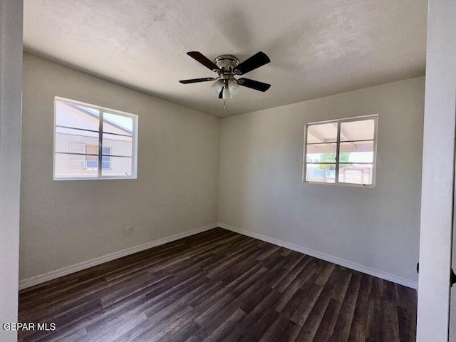 5017 Sierra Madre Dr, El Paso, TX 79904 - spare room with healthy amount of natural light, dark wood-style flooring, baseboards, and ceiling fan