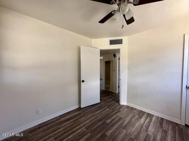 5017 Sierra Madre Dr, El Paso, TX 79904 - spare room featuring dark wood-style flooring, baseboards, and a ceiling fan