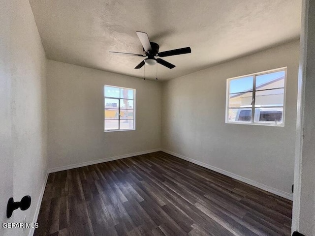 5017 Sierra Madre Dr, El Paso, TX 79904 - empty room featuring dark wood-type flooring, baseboards, and ceiling fan