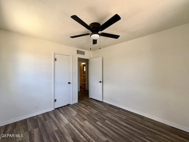 5017 Sierra Madre Dr, El Paso, TX 79904 - unfurnished bedroom with dark wood-style flooring, baseboards, and ceiling fan