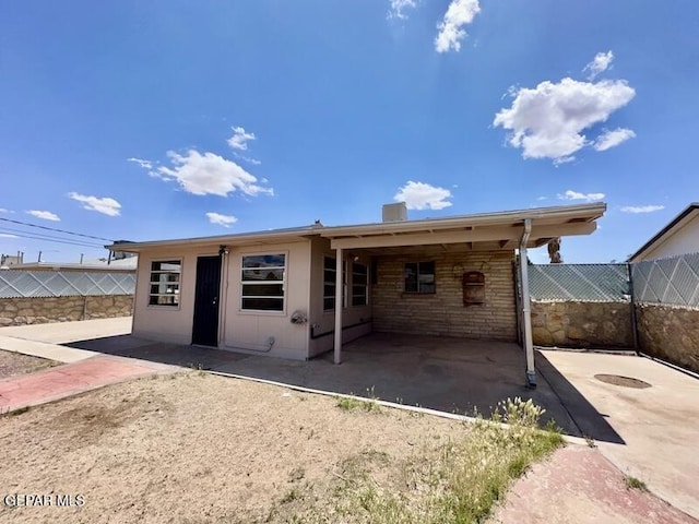 5017 Sierra Madre Dr, El Paso, TX 79904 - rear view of property with a patio area and fence