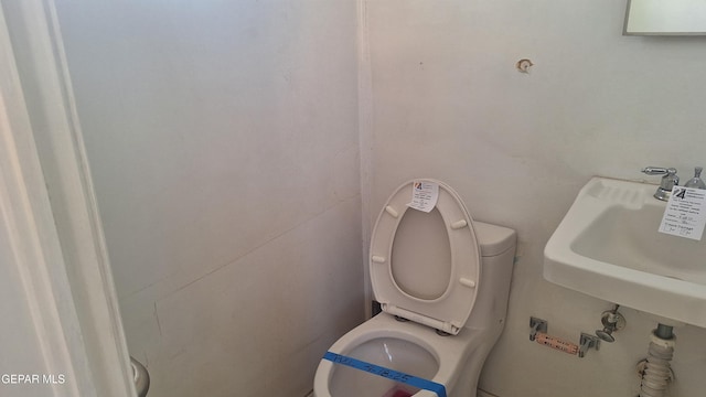 223 Kelvin Ave, El Paso, TX 79915 - bathroom featuring toilet and a sink