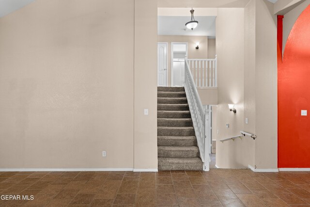 10740 White Sands Dr, El Paso, TX 79924 - staircase with baseboards