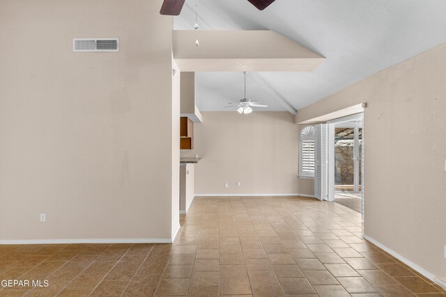 10740 White Sands Dr, El Paso, TX 79924 - unfurnished living room featuring a ceiling fan, vaulted ceiling, tile patterned flooring, and baseboards