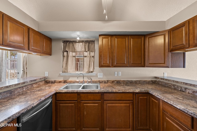 10740 White Sands Dr, El Paso, TX 79924 - kitchen featuring a sink, dishwasher, dark countertops, and brown cabinets
