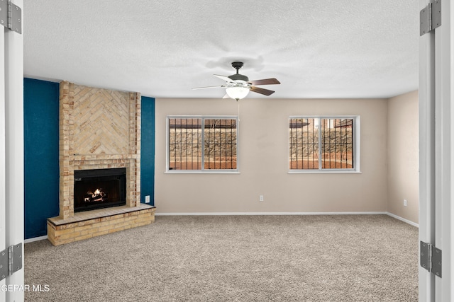 10740 White Sands Dr, El Paso, TX 79924 - unfurnished living room featuring a ceiling fan, carpet, healthy amount of natural light, and a textured ceiling
