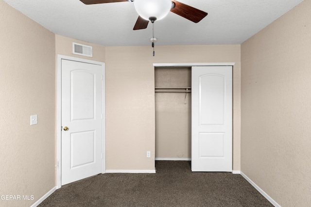 10740 White Sands Dr, El Paso, TX 79924 - unfurnished bedroom with dark colored carpet, baseboards, a closet, and ceiling fan