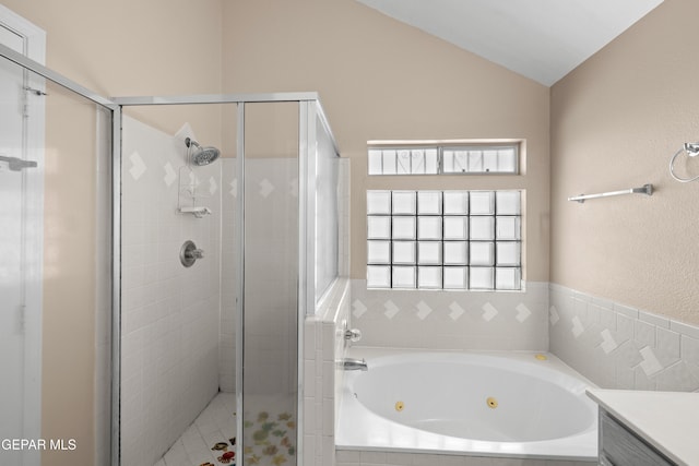 10740 White Sands Dr, El Paso, TX 79924 - full bathroom with a shower stall, a tub with jets, and vaulted ceiling