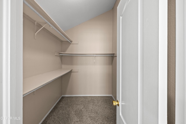 10740 White Sands Dr, El Paso, TX 79924 - walk in closet featuring carpet floors and vaulted ceiling