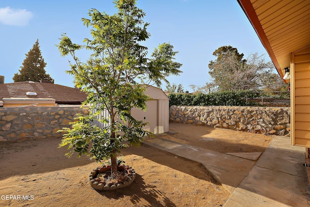 819 Los Surcos Rd, El Paso, TX 79907 - view of patio with a storage shed, an outbuilding, and a fenced backyard