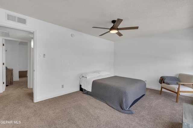 4433 Stanton St Unit T37, El Paso, TX 79902 - carpeted bedroom with a textured ceiling, baseboards, and a ceiling fan
