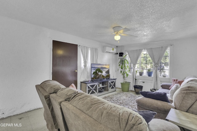 720 Johnson St, Fabens, TX 79838 - living room featuring a wall mounted air conditioner, a ceiling fan, and a textured ceiling