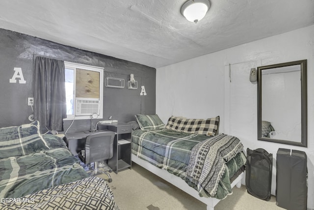 720 Johnson St, Fabens, TX 79838 - bedroom featuring cooling unit and a textured ceiling