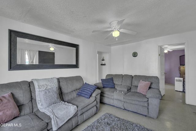 720 Johnson St, Fabens, TX 79838 - living area featuring ceiling fan and a textured ceiling