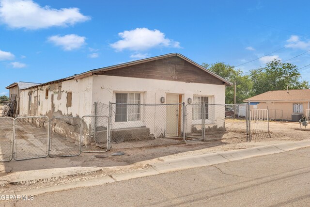 720 Johnson St, Fabens, TX 79838 - view of front of property with a gate, central AC, and fence