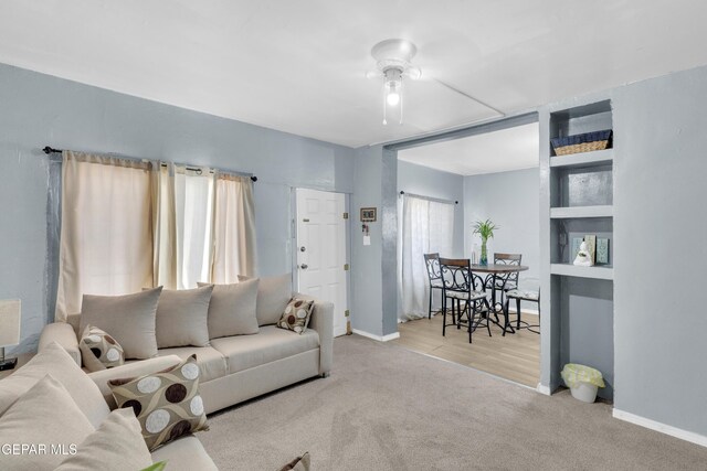 720 Johnson St, Fabens, TX 79838 - carpeted living area featuring a ceiling fan and baseboards
