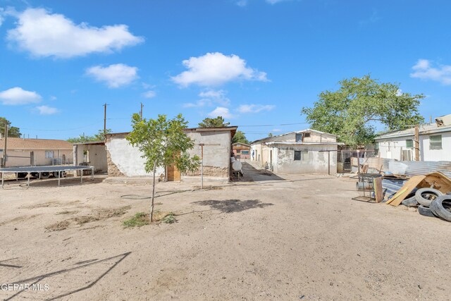 720 Johnson St, Fabens, TX 79838 - view of front of house featuring a trampoline, fence, and a residential view