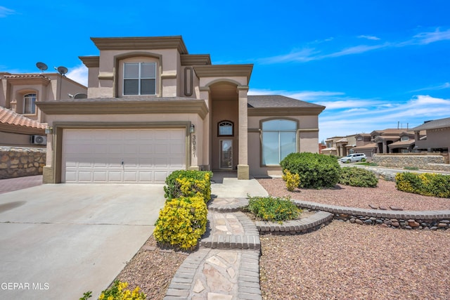 3081 Tierra Humeda Dr, El Paso, TX 79938 - view of front facade featuring concrete driveway, stucco siding, and a garage