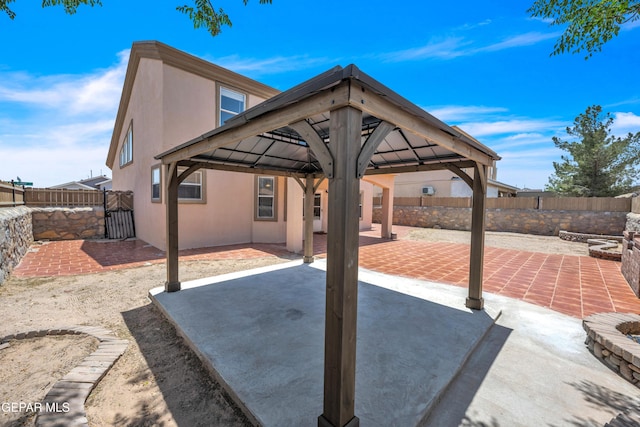 3081 Tierra Humeda Dr, El Paso, TX 79938 - fenced backyard with a gazebo, a patio area, and a gate