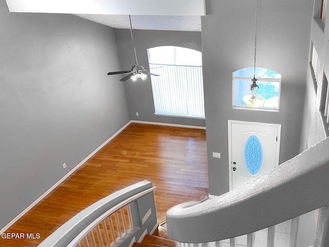 3081 Tierra Humeda Dr, El Paso, TX 79938 - entrance foyer featuring wood finished floors, baseboards, ceiling fan, and high vaulted ceiling