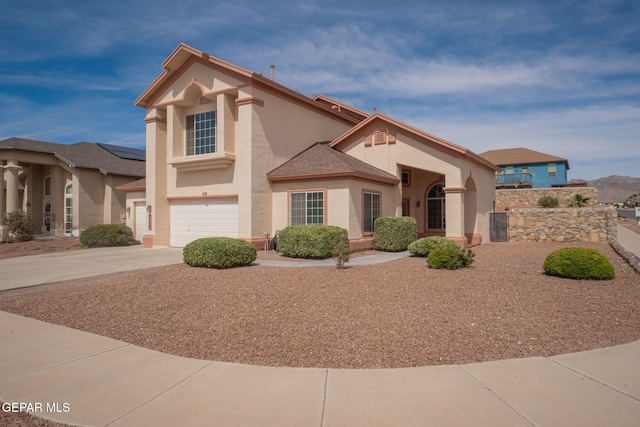 7350 Rosas Way, Canutillo, TX 79835 - view of front of property featuring stucco siding, concrete driveway, and an attached garage