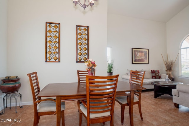 7350 Rosas Way, Canutillo, TX 79835 - dining space featuring light tile patterned floors, a chandelier, and baseboards