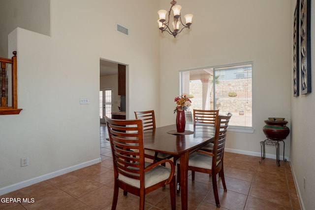 7350 Rosas Way, Canutillo, TX 79835 - tiled dining room featuring a high ceiling, a chandelier, and baseboards