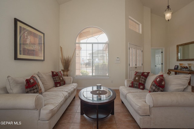 7350 Rosas Way, Canutillo, TX 79835 - tiled living area featuring a high ceiling and baseboards