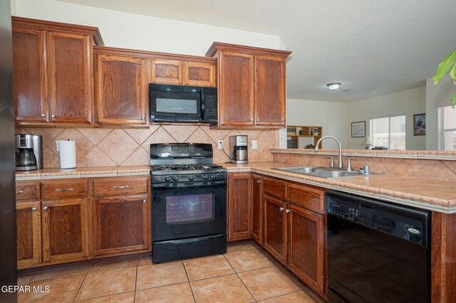 7350 Rosas Way, Canutillo, TX 79835 - kitchen with black appliances, a sink, decorative backsplash, and light countertops