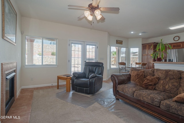 7350 Rosas Way, Canutillo, TX 79835 - living area with plenty of natural light, ceiling fan, a tiled fireplace, and baseboards