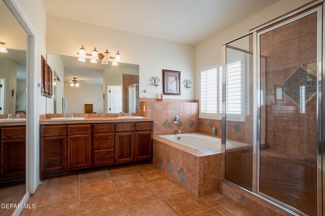 7350 Rosas Way, Canutillo, TX 79835 - bathroom with a shower stall, a garden tub, double vanity, tile patterned floors, and ceiling fan