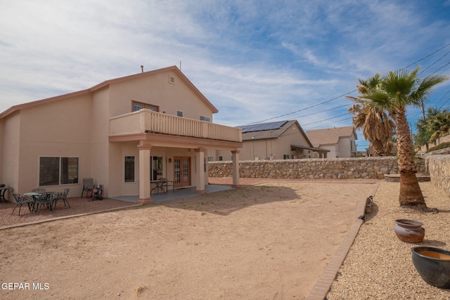 7350 Rosas Way, Canutillo, TX 79835 - back of house with a balcony, a patio, stucco siding, and a fenced backyard