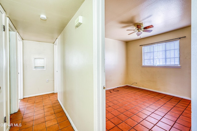 4209 Hercules Ave, El Paso, TX 79904 - hall with light tile patterned floors and baseboards