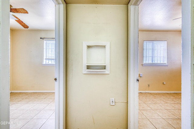 4209 Hercules Ave, El Paso, TX 79904 - hallway with light tile patterned flooring and baseboards