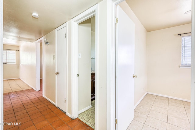 4209 Hercules Ave, El Paso, TX 79904 - hallway with light tile patterned flooring and baseboards